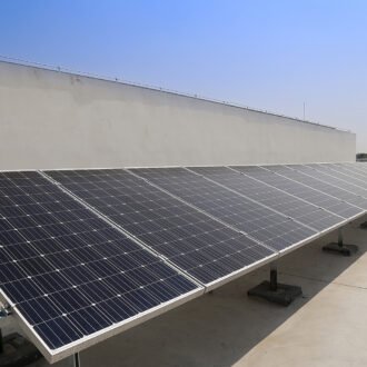 Solar-panel-on-a-commercial-rooftop Solar-panel-on-a-commercial-rooftop